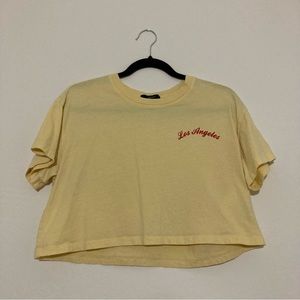 Forever 21 pastel yellow ‘Los Angeles’ text short sleeve crop top